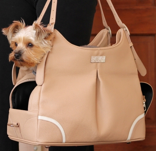 Doggie Design - Madison Mia Michele Mocha Carry Bag - Airline Approved. Doggie Design's new Madison Mocha Carry Bag was made to look like a Womans Designer Hand Bag. Now you can take your little Angel with you wherever you go and NO ONE will ever know whats inside your bag. It features High Quality Pebbled Black Faux Leather and is lined with Satin Black Waterproof Fabric. Your little Angel will LOVE the super soft plush pillow with removable and washable cover. The inside pillow is covered with waterproof fabric. The "Madison" Bag features 2 large pockets for storage. It has plenty of room for your personal items, including your I-Pad or Tablet. "Madison" is vented on the top and can be concealed for Privacy.  Includes shoulder strap, leash tether, and has metal feet on the bottom to provide protection to the bag.