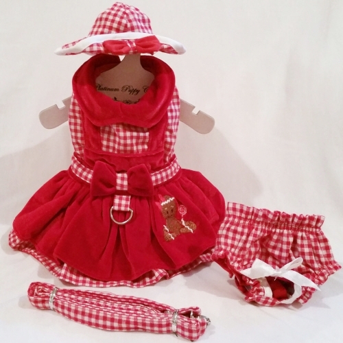 Platinum Puppy Couture - Gingerbread Girl Jumper Style Velveteen 4pc Harness Dress Set - This Gingerbread Girl dog dress set is absolutely beautiful! It is made with a red and white gingham print and red velveteen fabric. It has a double ruffle design. There is a sweet gingerbread girl embroidery design on the right side of the skirt. This dog dress has an added D-ring for easy leash access. The set includes harness dress, panty, hat, and matching leash. The panty is great to use if your pet is in season or just as part of the outfit. It also looks darling on those dogs with a slightly longer body (if dresses are usually too short). High quality...all pieces are lined and finished.