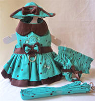 Platinum Puppy Couture - Simply Sweet 4-pc Harness Dress Set (Dress, Hat, Panties, Leash).  This dress is cute as well as unique and classically styled. It is made in a refreshing aqua blue and chocolate brown polka dot fabric. It has a contrasting chocolate brown collar, belt, and under ruffle. There is a sweet piece of candy embroidered on the bodice of the dress, and lollypop embellishment embroidered on the skirt.