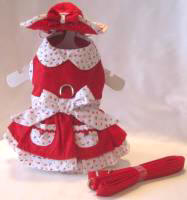 Platinum Puppy Couture - Very Cherry Harness Dress Set with Matching Hat and Leash - This little red harness dress set is so sweet!!  The dress has a contrasting white mini cherry collar and bow design.  The skirt has double contrasting layers for added fullness.  The skirt also has mini white cherry pockets with baby buttons and trim.  There is an added D-ring for easy leash access.  This set comes with harness dress, matching flip front hat and leash.